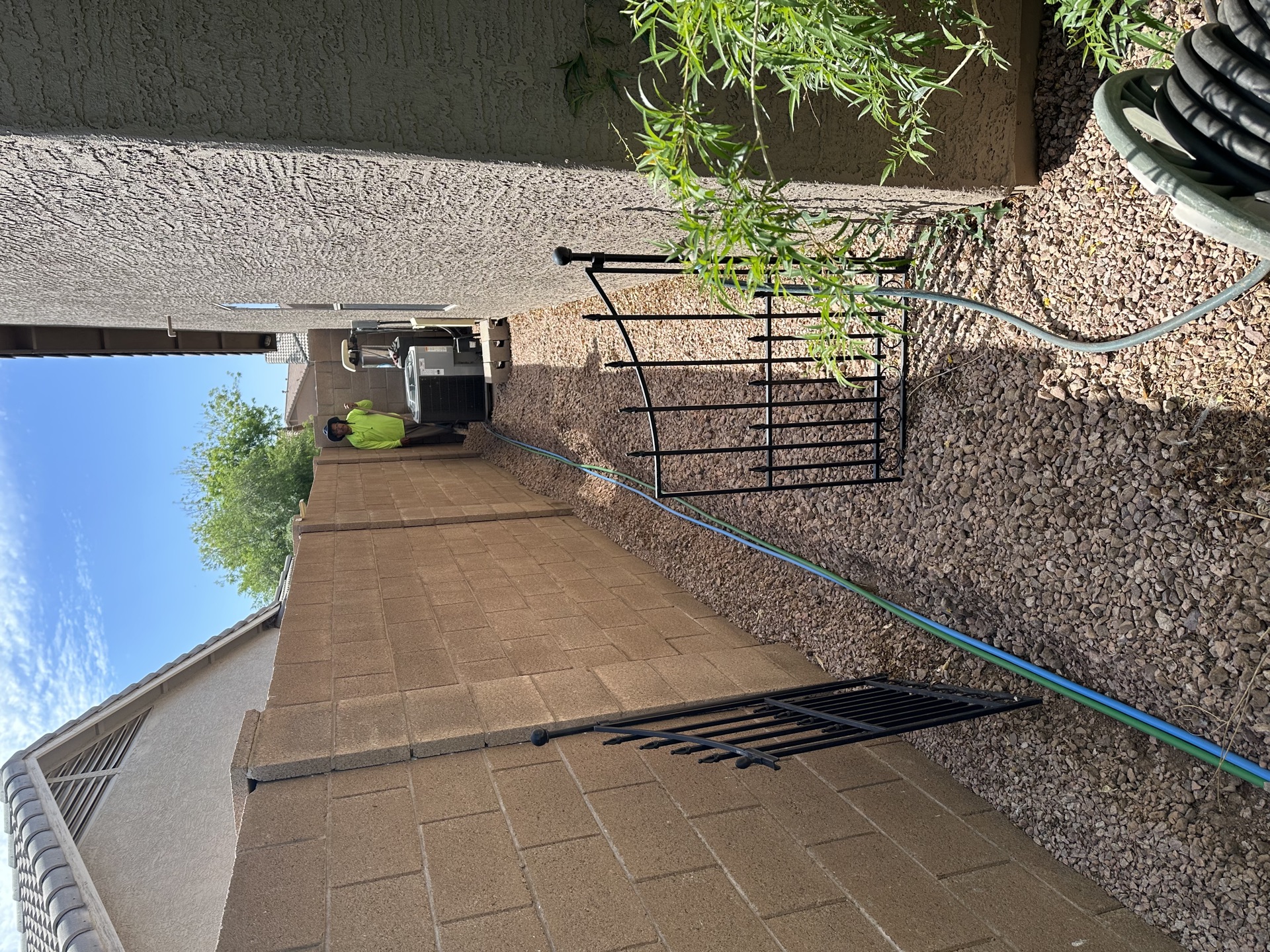 Side yard landscape with pavers and gate