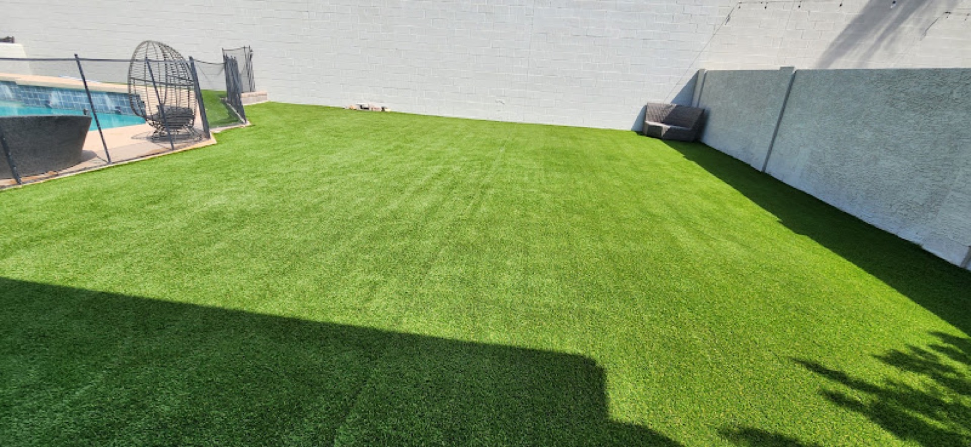 Large backyard turf with pool