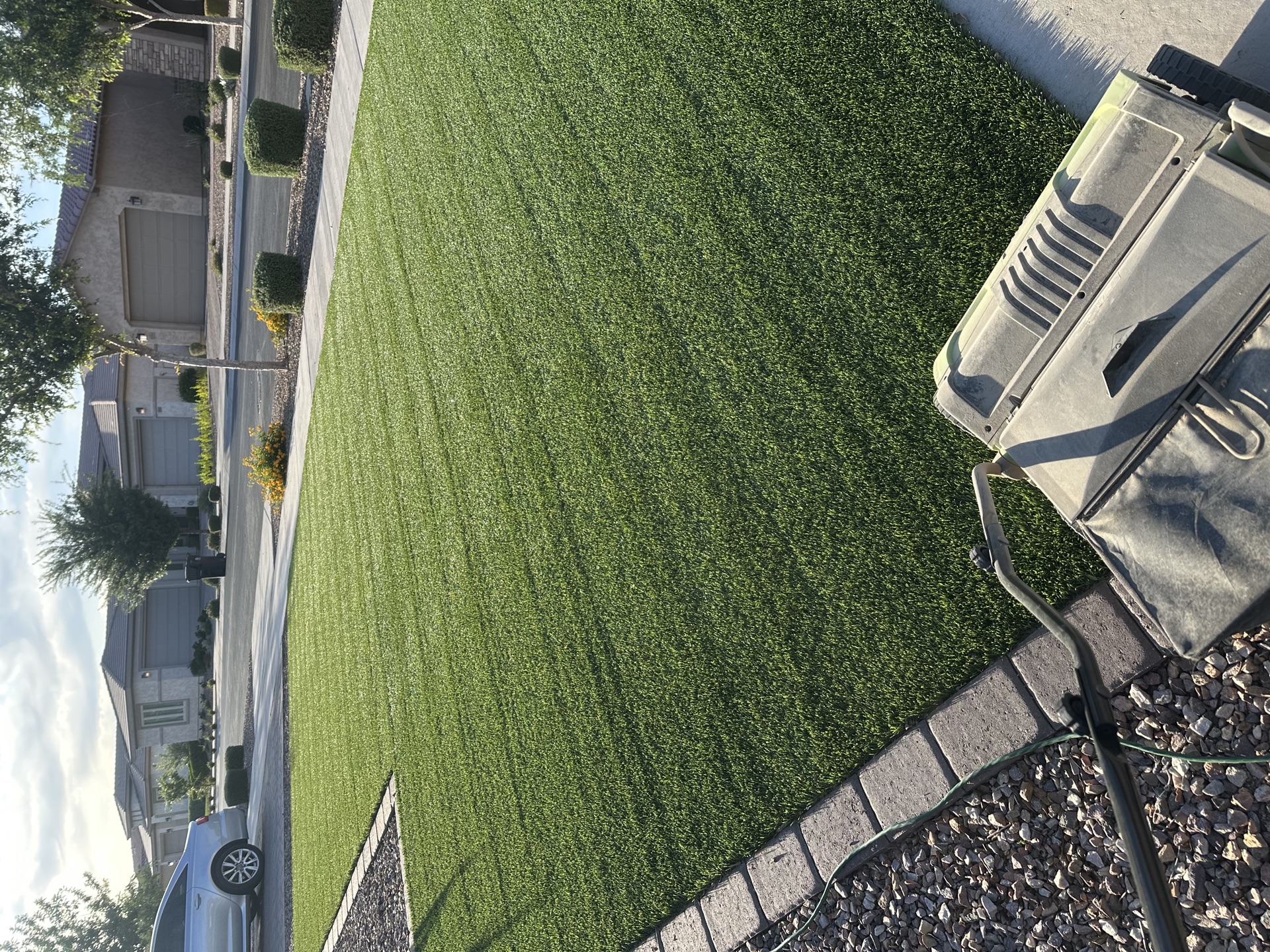 Turf cleaning service in progress at a Queen Creek, AZ residential property