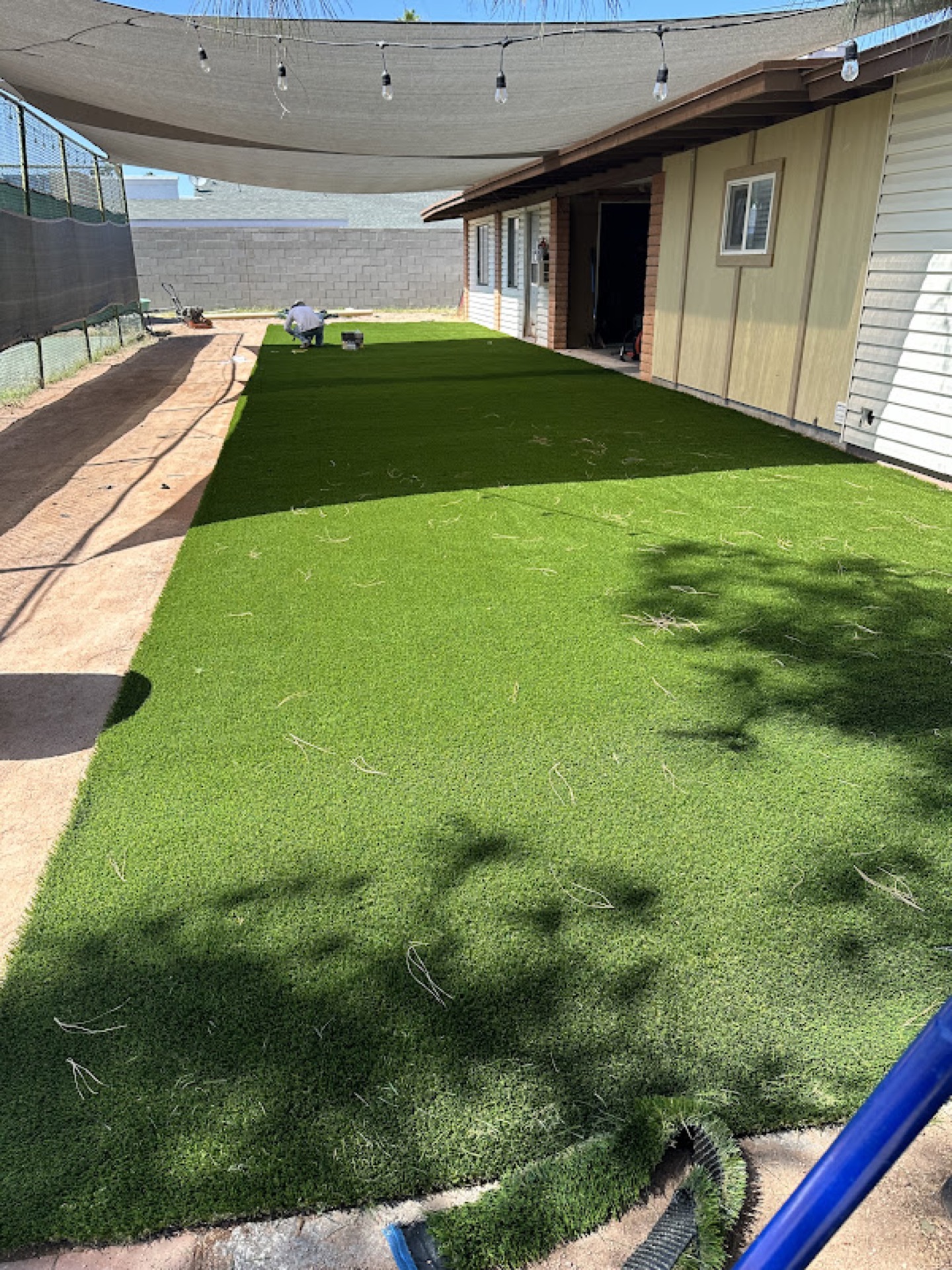 Turf installation with shade sail