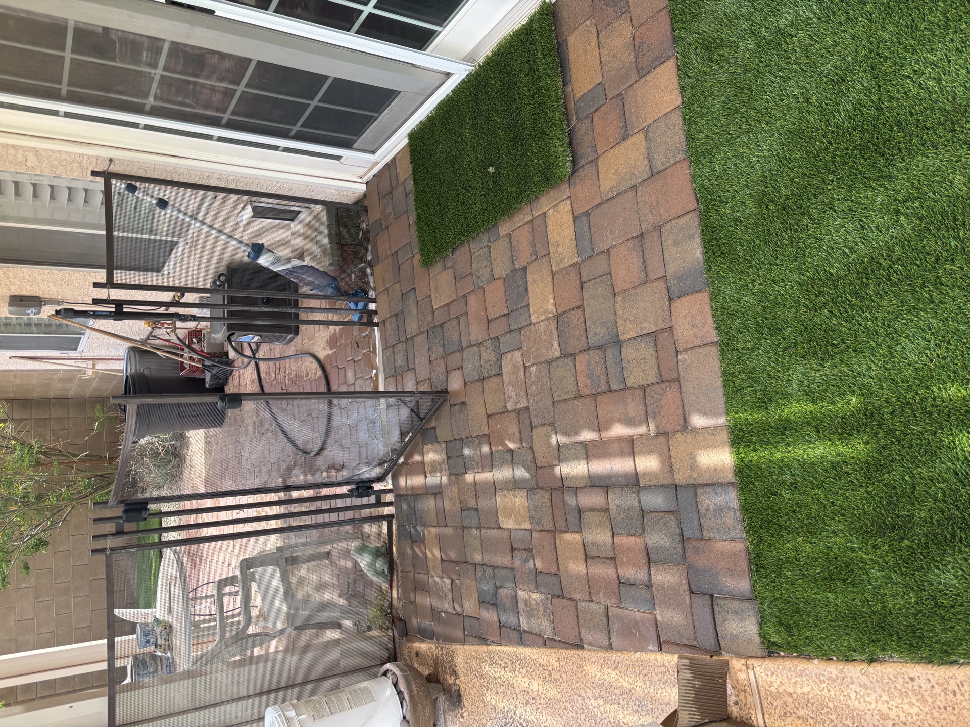 Turf and paver grid design with landscape lighting