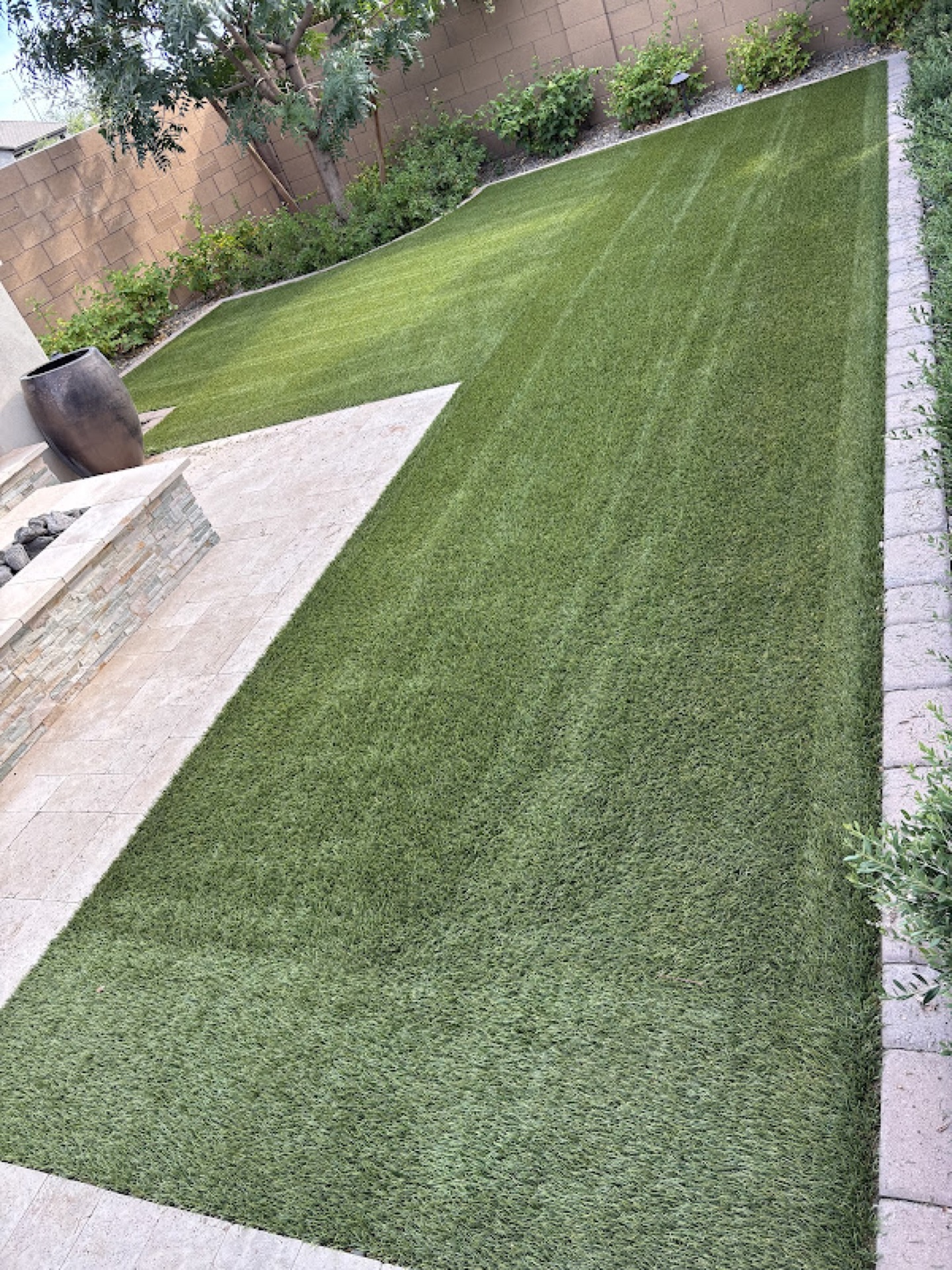 Clean turf with travertine border