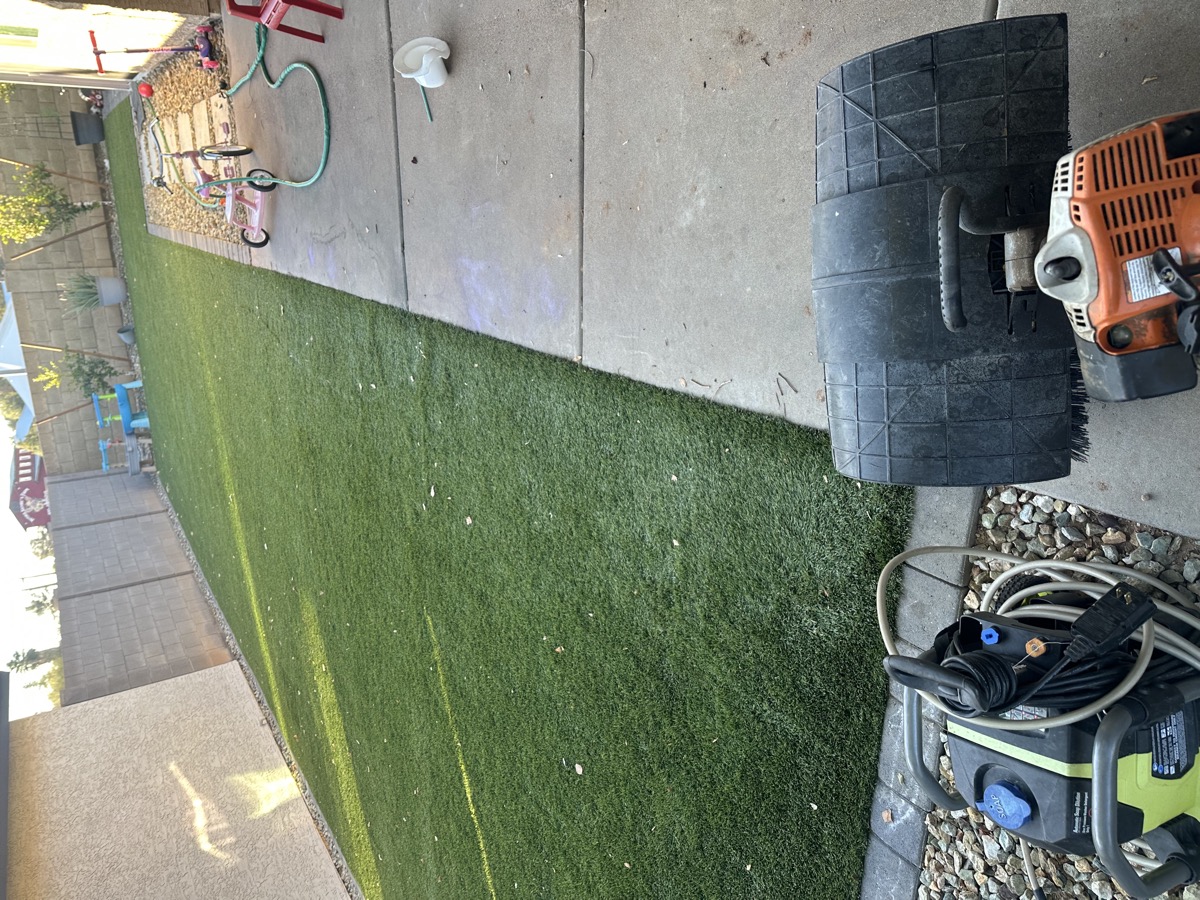 AZ Turf Cleaning crew repairing paver joints at a Mesa AZ residential patio