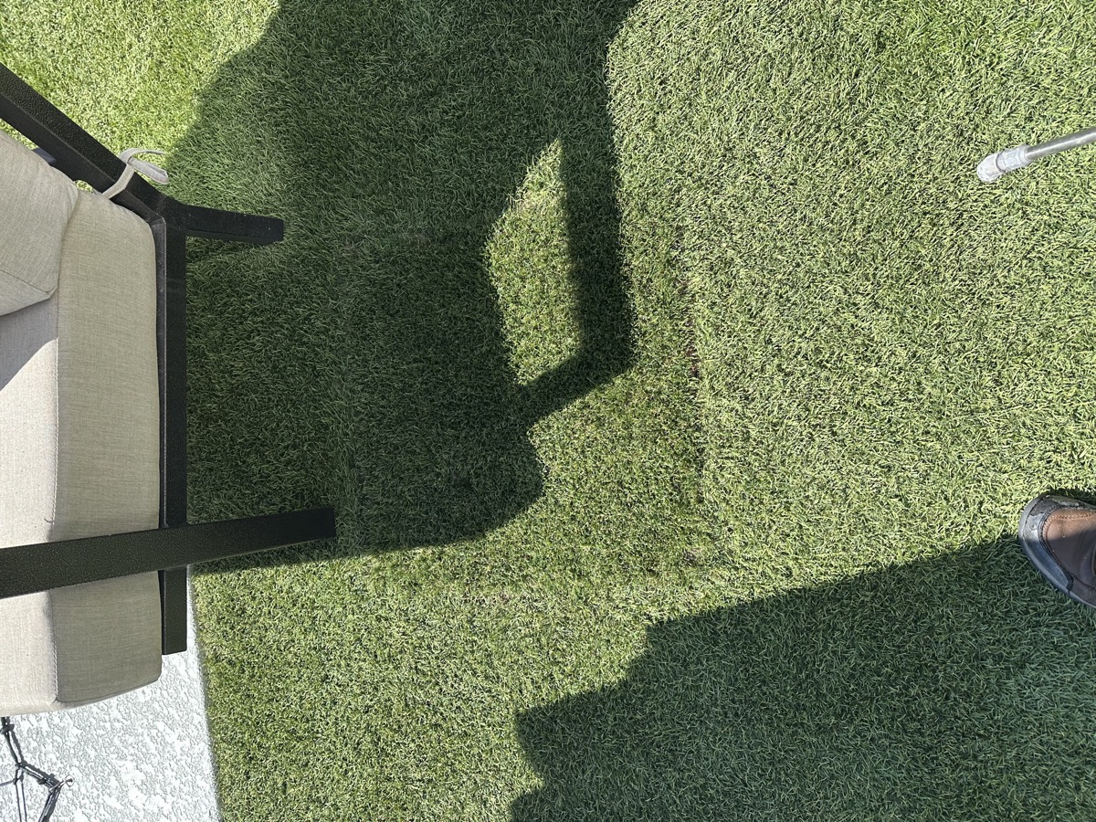 Completed paver patio and artificial turf installation by AZ Turf Cleaning in a Mesa AZ backyard