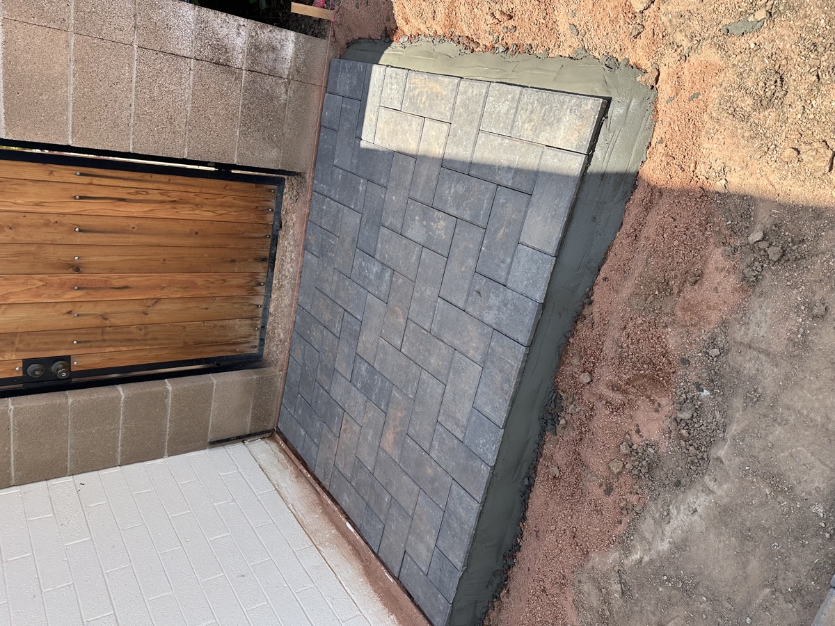 AZ Turf Cleaning crew treating a pet turf yard in Mesa, AZ with enzyme solution